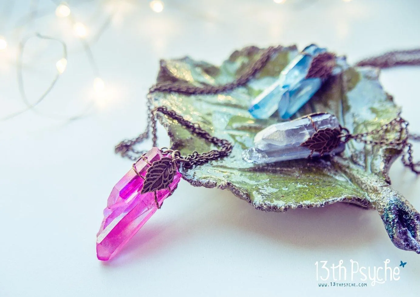 Colorful raw quartz crystal point pendant necklace with leaves