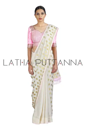 Kumkuma - Dramatic Off-White Saree with Gold Polkas