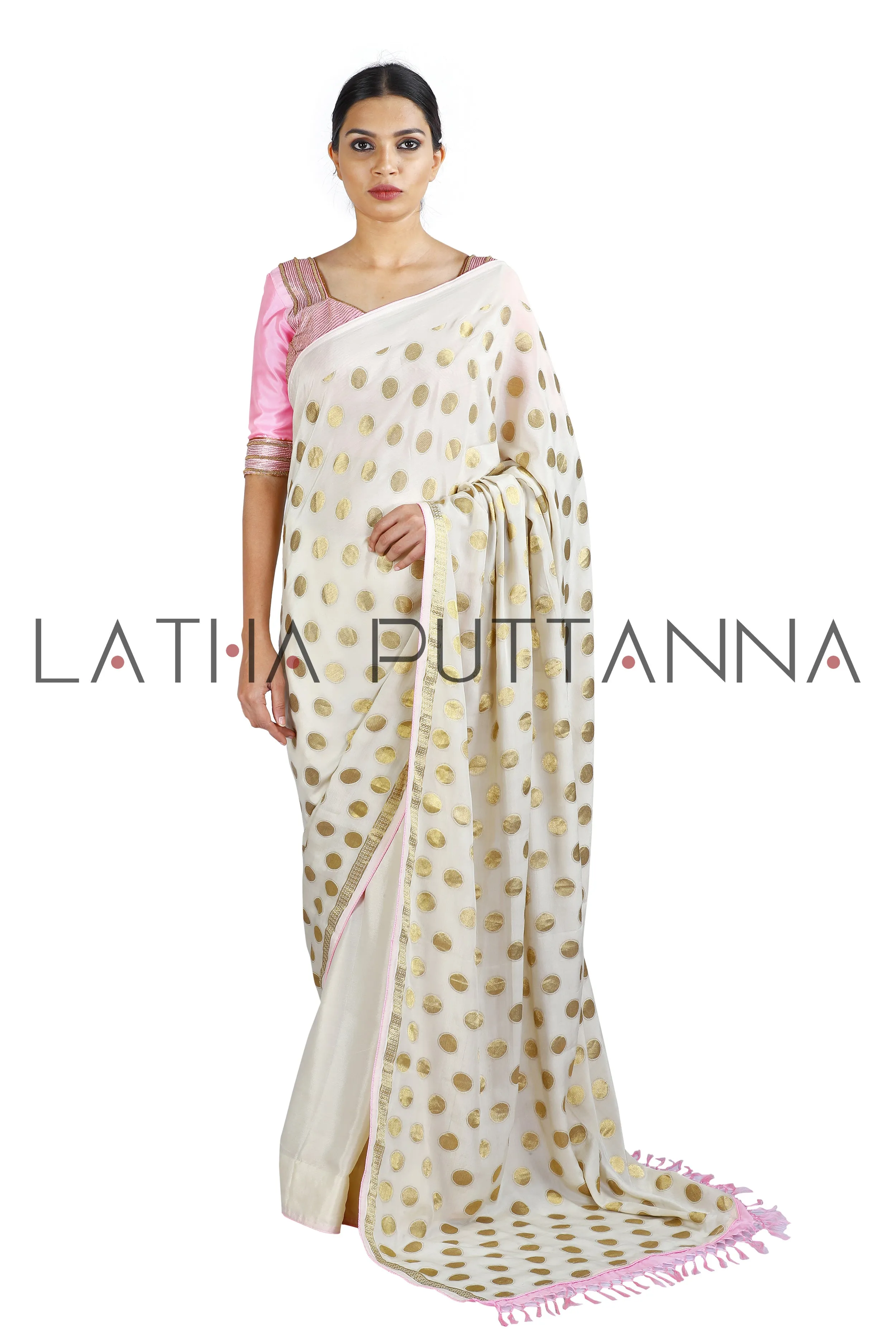 Kumkuma - Dramatic Off-White Saree with Gold Polkas