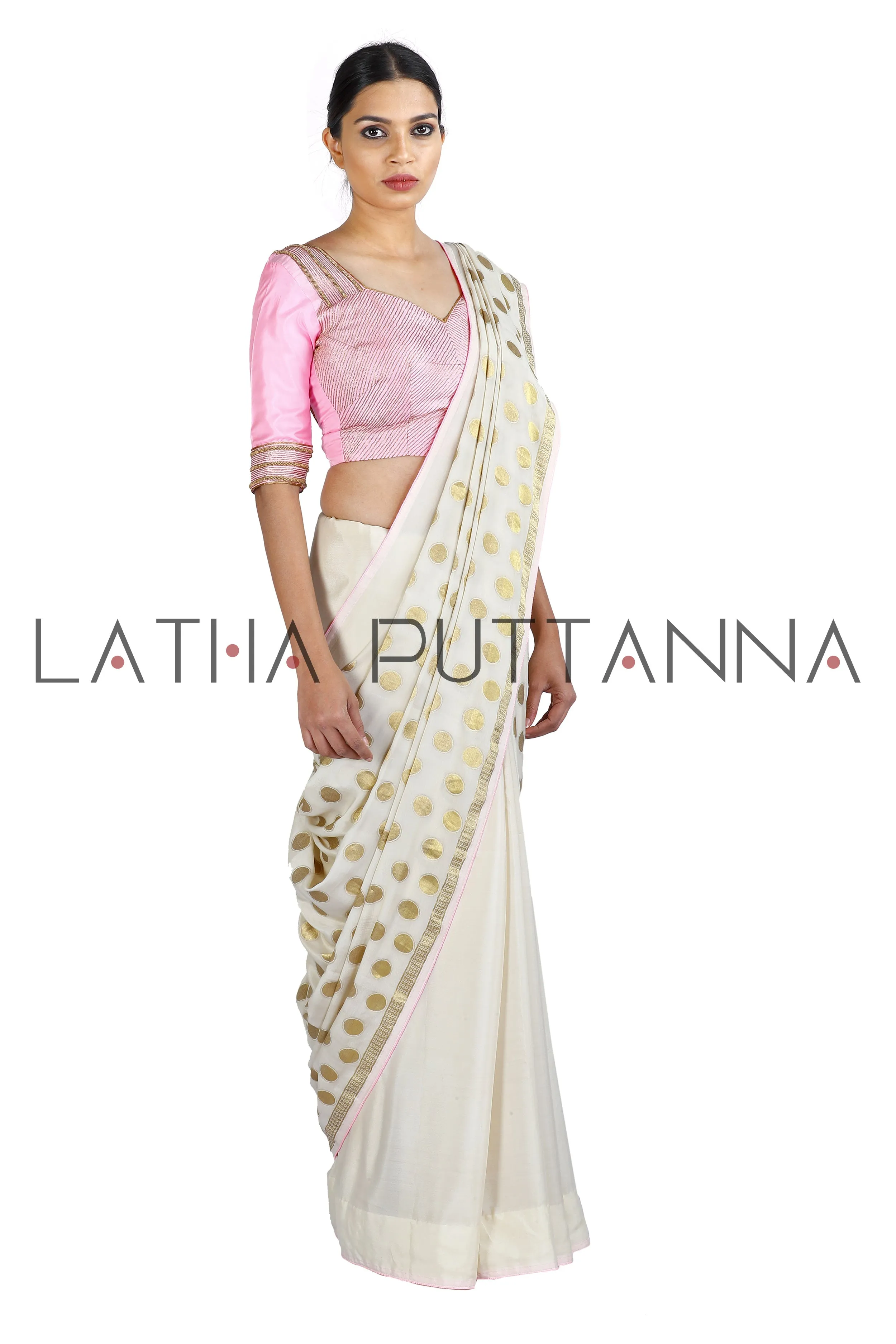 Kumkuma - Dramatic Off-White Saree with Gold Polkas