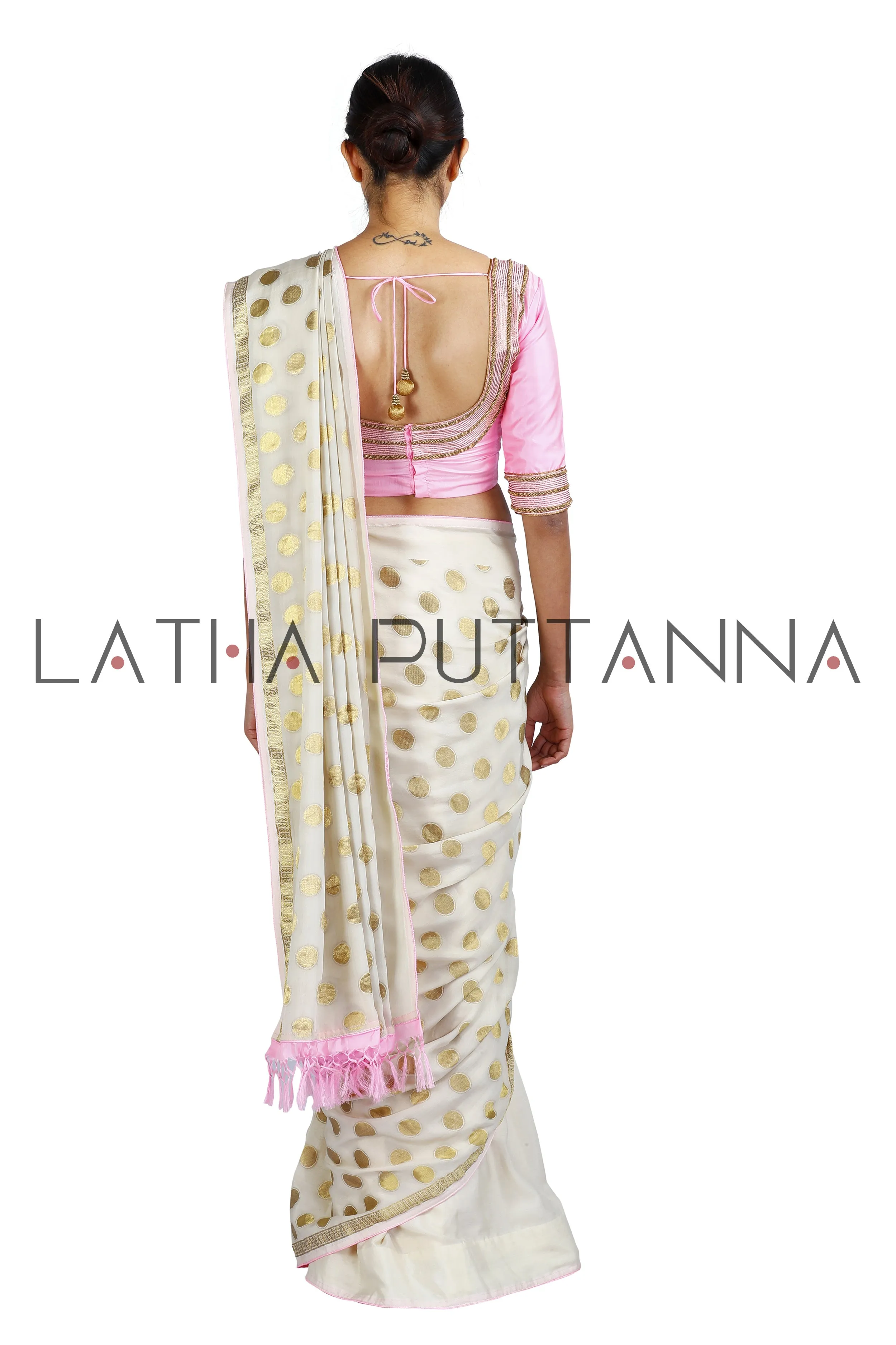 Kumkuma - Dramatic Off-White Saree with Gold Polkas